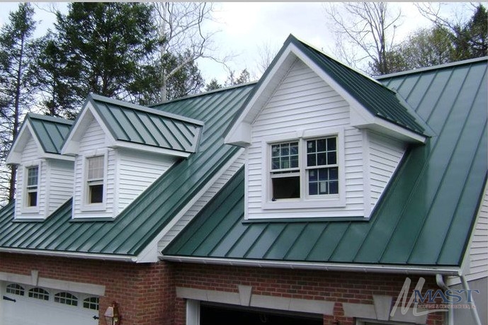 Green standing seam metal roof with dormer windows