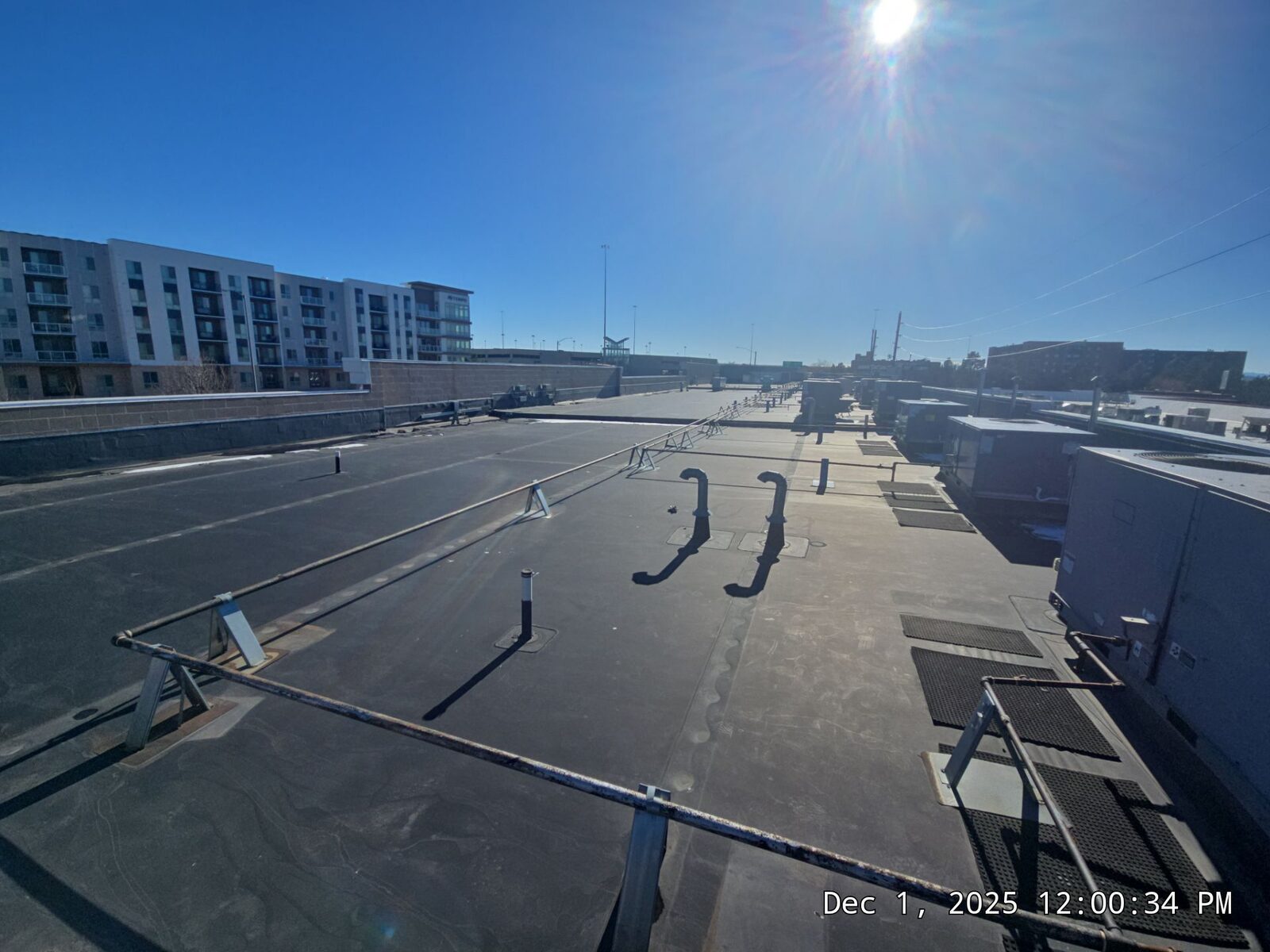 EPDM rubber membrane on a commercial flat roof with rooftop HVAC units