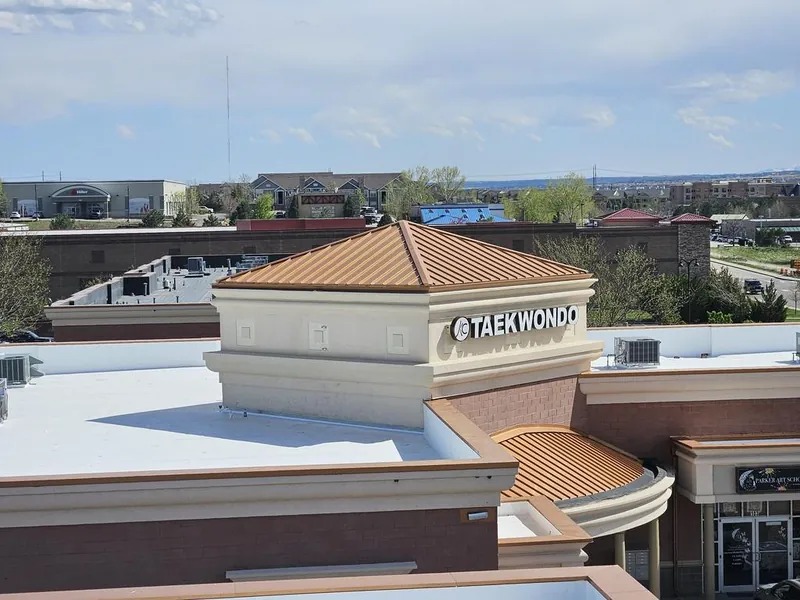 White TPO membrane on a retail commercial flat roof with rooftop HVAC units